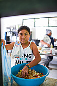 Portrait of young female cook assistant in Colombia