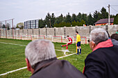 Corner kick during soccer youth game in small town of Hungary