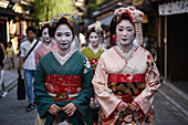 Group of women dressed as Maikos in the streets of Kyoto, Japan