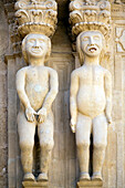 Nude figures with Indian influence adorn the facade of the Palace of Salvatierra, showcasing unique artistic details in Ronda, Spain.