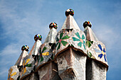 Barcelona, Spain, Sept 4 2008, The colorful chimeneas crown Casa Batlló, showcasing Gaudís iconic design against a clear sky in Barcelona.