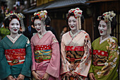 Group of women dressed as Maikos in the streets of Kyoto, Japan