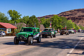 Vehicles decorated with American flags in the Fourth of July Parade on Independence Day in Moab, Utah.