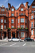 London, UK, May 3 2009, A striking Victorian building showcases red brick design and intricate details on Pont Street in Kensington, London.