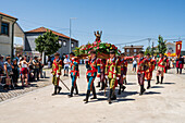 Religious procession enters São João Baptista Church during the Festival of Saint John of Sobrado, also known as Bugiada and Mouriscada de Sobrado, takes place in the form of a fight between Moors and Christians , locally known as Mourisqueiros and Bugios, Sao Joao de Sobrado, Portugal