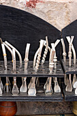 Traditional bombillas, or metal straws for drinking yerba mate tea, for sale in the market in Purmamarca, Argentina.