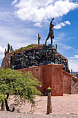 Monument to the Heros of lndependence in Humahuaca in the Humahuaca Valley or Quebrada de Humahuaca, Argentina. The single statue on the monument depicts an indigenous man.