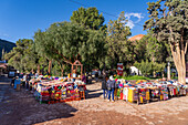 Tourists shop for souvenirs in the open market on the 9th de Julio Plaza in Purmamarca, Argentina.