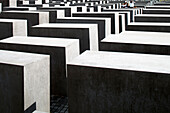 Berlin, Germany, July 24 2009, Visitors explore the intricate layout of the Holocaust Memorial in Berlin, reflecting on its poignant symbolism and design.