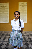 Portrait of young school girl in Quinta de San Pedro Alejandrino, where Simon Bolivar spent his last days, Santa Marta, Colombia