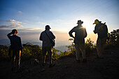 Hikers enjoying a beautiful sunset in Sierra Nevada de Santa Marta, Colombia