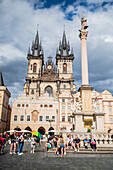 Marian Column (Mariánský sloup) in front on the Tyn Church (Týnský chrám) in Old Town Square (Staromestské námestí) in Prague