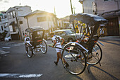 Rickshaw man at sunset in Kyoto, Japan