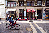 Woman cycling in the streets of Budapest