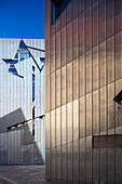 The striking architecture of the Jewish Museum stands out in Berlin, showcasing modern design elements and historical significance.