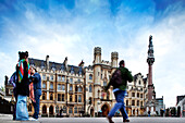 London, UK, May 2 2009, People stroll by the historic Broad Sanctuary building in Westminster, showcasing 19th century architecture against a vibrant sky.