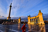 Runner on Heroes Square at sunset, Budapest, Hungary