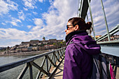 Szechenyi Chain Bridge in Budapest Young woman on Szechenyi Chain Bridge in Budapest