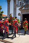 Religious procession enters São João Baptista Church during the Festival of Saint John of Sobrado, also known as Bugiada and Mouriscada de Sobrado, takes place in the form of a fight between Moors and Christians , locally known as Mourisqueiros and Bugios, Sao Joao de Sobrado, Portugal