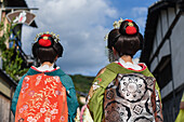 Group of women dressed as Maikos in the streets of Kyoto, Japan