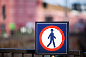 A no pedestrian sign is prominently displayed in an urban setting in Berlin, Germany, indicating restricted access for foot traffic.