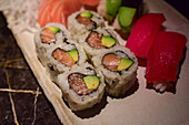 Assorted nigiri and sushi rolls in Sushi restaurant