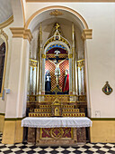 A side altar and altarpiece in the Cathedral of Our Lady of the Rosary in Cafayate, Salta Province, Argentina.