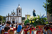 Religious procession enters São João Baptista Church during the Festival of Saint John of Sobrado, also known as Bugiada and Mouriscada de Sobrado, takes place in the form of a fight between Moors and Christians , locally known as Mourisqueiros and Bugios, Sao Joao de Sobrado, Portugal