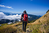 Young man hiking in the mountains of Sierra Nevada de Santa Marta, Colombia