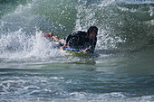 Bodyboarder in Grande Plage beach of Biarritz, France