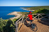 Cyclist at Porto Selvaggio, Nardo, Lecce, Salento, Apulia, Italy, Europe