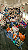 Passengers in the back of a Cargo plane, Kindu, Maniema, Democratic Republic of Congo, Africa