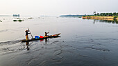 Aerial of a dugout canoe on the Congo River, Mbandaka, Equateur province, Democratic Republic of Congo, Africa