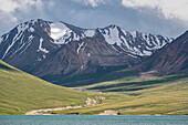 Scenic mountain landscape with lush greenery and snow-capped peaks above Kol Ukok Lake, Kyrgyzstan, Central Asia, Asia