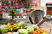 Street vendor selling fruit in Getsemani area, Cartagena, Colombia, South America