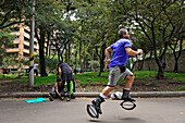 Man doing kangoo jumps training, Zona Rosa area, Bogota, Colombia, South America