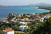 View over the village and coastline to distant Arbatax, Santa Maria Navarrese, Baunei, Nuoro, Sardinia, Italy, Mediterranean, Europe