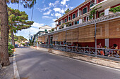 View of restaurant on main street in Palaiokastritsa, Palaiokastritsa, Corfu, Ionian Sea, Greek Islands, Greece, Europe