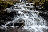 A close-up view of a cascading waterfall in the Faroe Islands, Denmark, Atlantic, Europe