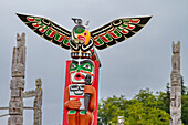 Totem poles in the cemetery of the First Nations Kwakwaka'wakw people in Alert Bay, British Columbia, Canada, North America