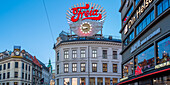 View of neon lights and architecture on Karl Johans Gate at dusk, Oslo, Norway, Scandinavia, Europe