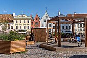 Views of old historical and traditional buildings and visitors to the Old Town, UNESCO World Heritage Site, in central Tallinn, Estonia, Europe