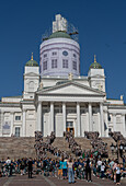 View of university students celebrating their graduation outside Helsinki Cathedral in central Helsinki, Finland, Europe