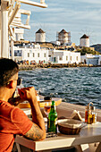 View from restaurant of windmills, Mykonos Town, Mykonos, Cyclades, Greek Islands, Greece, Europe