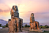 Colossi of Memnon, massive stone statues of Pharaoh Amenhotep III in the Theban Necropolis, UNESCO World Heritage Site, Luxor, Egypt, North Africa, Africa