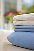 Close up of a stack of bed linen