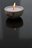 Burning pink tea light