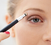 Close-up View of Woman Applying Eye Shadow