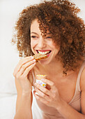 Woman Eating Toast and Soft Boiled Egg