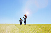 Family Playing on Field